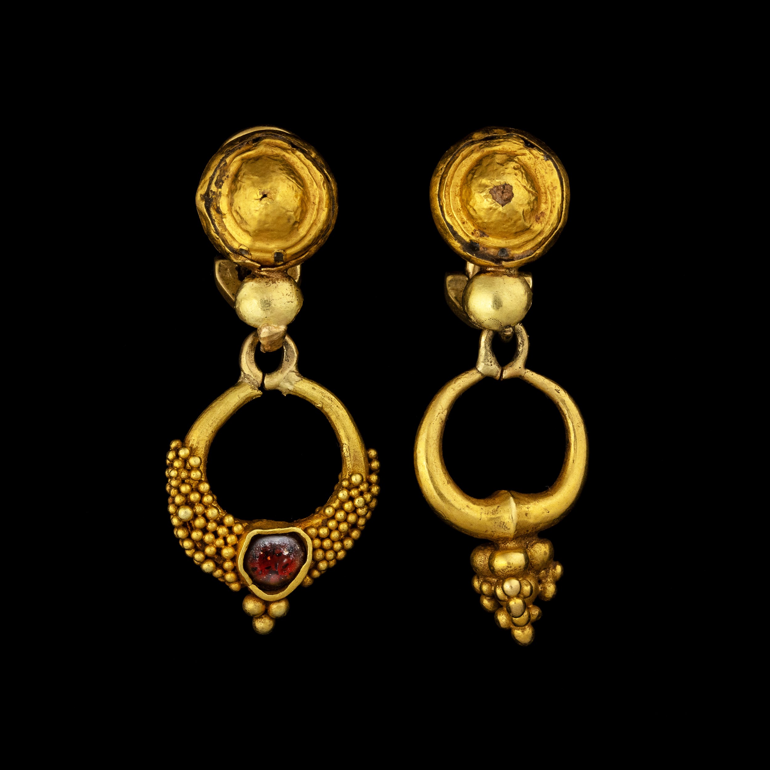 Pair of gold earrings made of Hellenistic gold elements. 